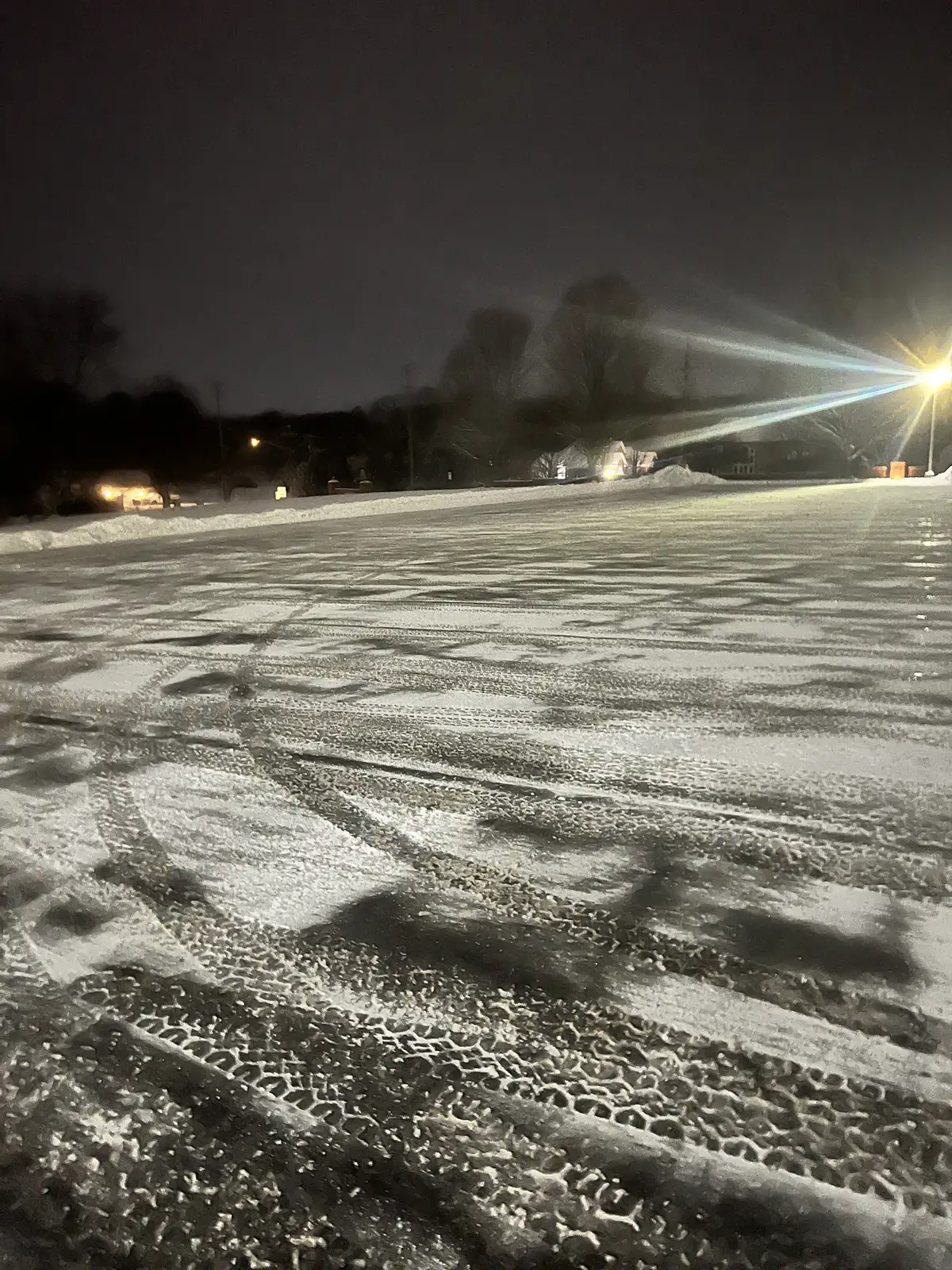 Sidewalk snow clearing equipment operating at a commercial property in Batavia, Illinois