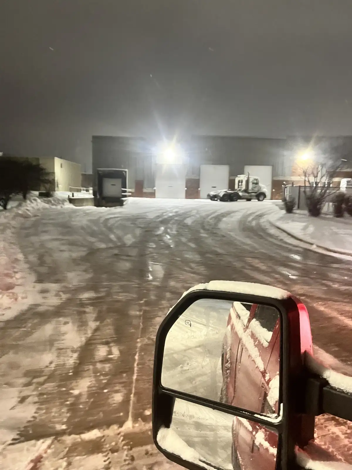 Commercial snow plowing at night in Aurora, IL